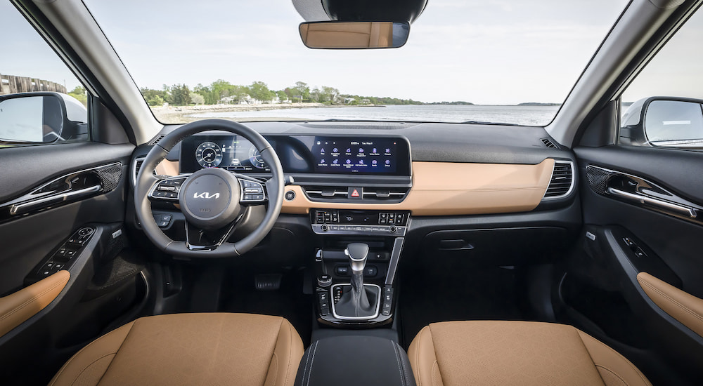 The brown and black interior of a 2025 Kia Seltos.