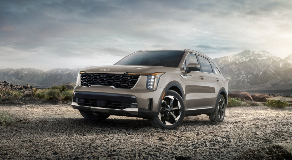 A tan 2025 Kia Sorento PHEV parked off-road