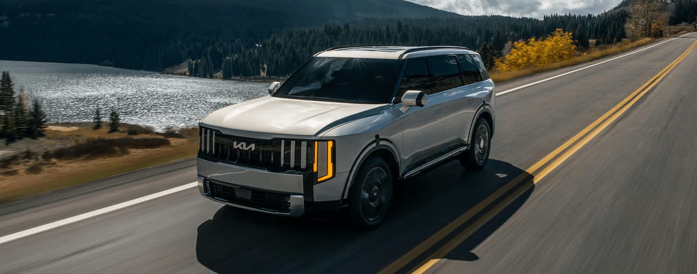 Grey 2027 Kia Telluride driving on a highway