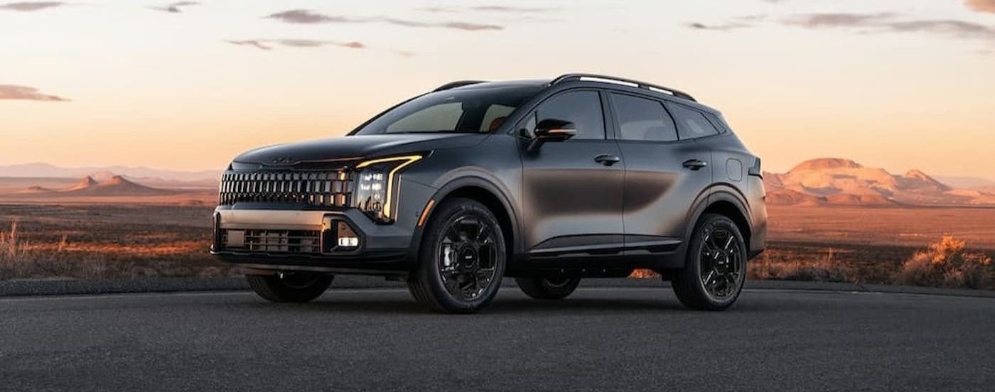 A gray 2026 Kia Sportage parked on concrete.
